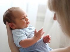 What is the immaturity of the brain in newborns and what signs indicate it?