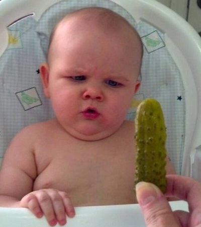 Child with cucumber