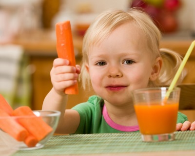 Girl drinking carrot juice