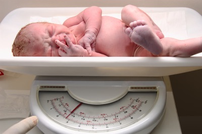 Weighing a newborn