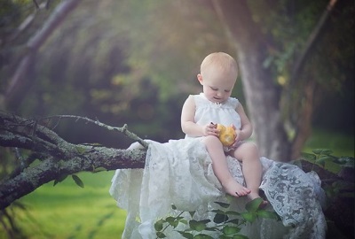 Baby with pear